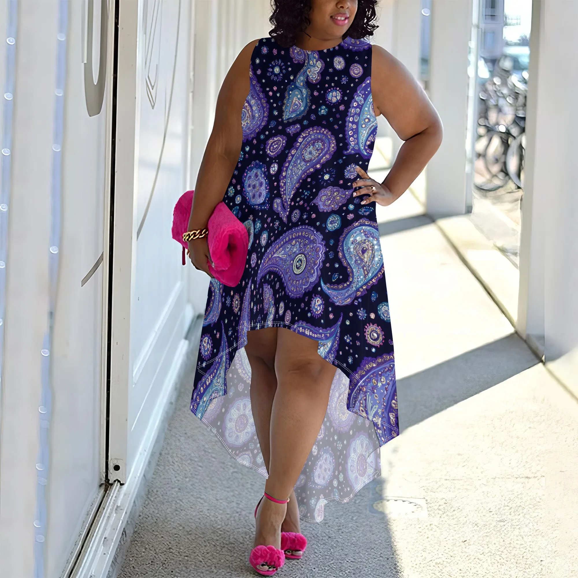 Elegant plus size high-low dress featuring a stylish paisley pattern in deep purples and blues, perfect for any occasion